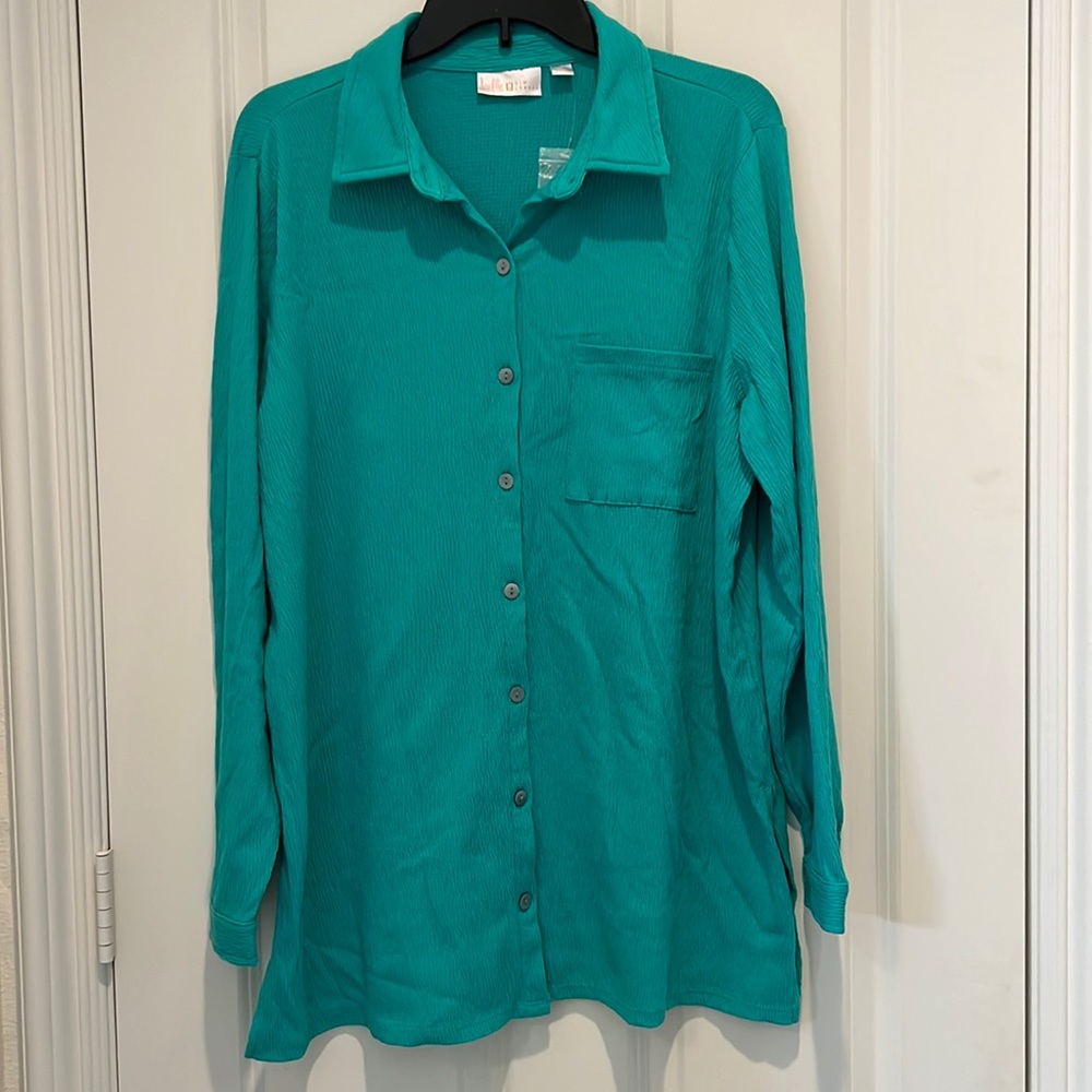Tunic length boyfriend shirt. Single front pocket, long sleeves with button cuff
